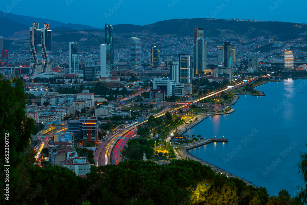 Fototapeta premium View of Izmir Bay in the evening from the high hill of Bayrakli. Long exposure, low light.