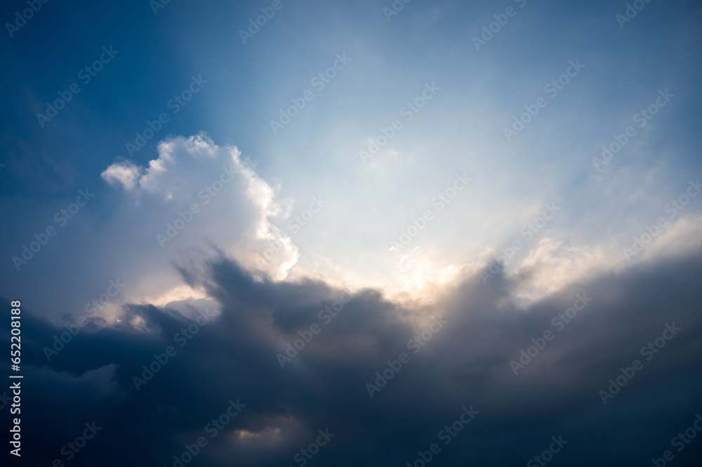 Obraz premium Blue sky and unpredictable white clouds. Amazing nature. Impact of climate change on the environment.
