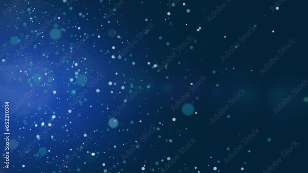 Animated particles flying from left to right on blue background - CGI render Animated particles flying from left to right on blue background - CGI render