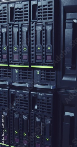 Vertical video of a large computer server room in a data center