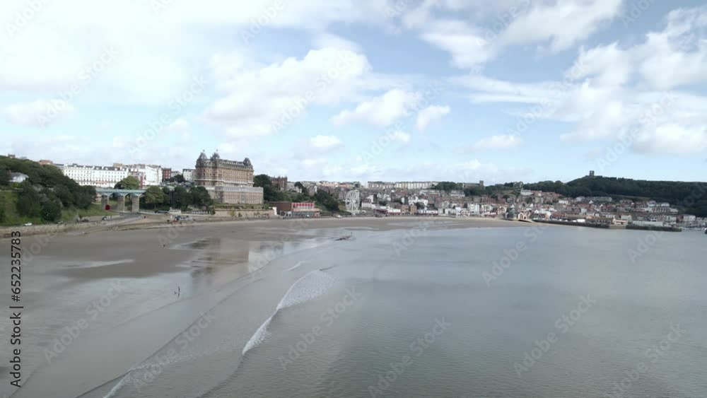 Aerial pan view of Scarborough town, beach, harbor and castle Aerial pan view of Scarborough town, beach, harbor and castle