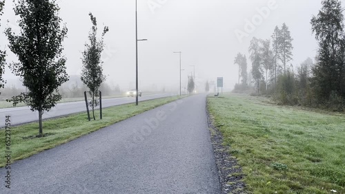 Kempele, Finland – 09/14/2023:Traffic in foggy weather photo