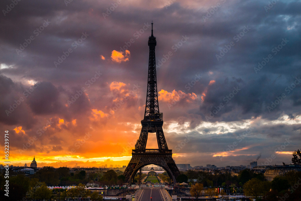 Dramatic sunrise behind the Eiffel Tower. Spring morning in Paris, France