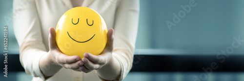 mental health and wellbeing positive environment at school university education learning community group, abstract background banner with copy space of woman female holding smile ball photo