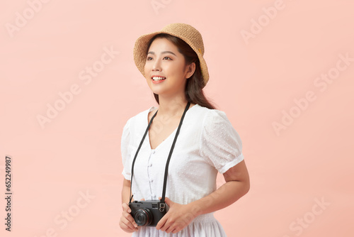 smiling Woman photographer is taking images photo with dslr camera