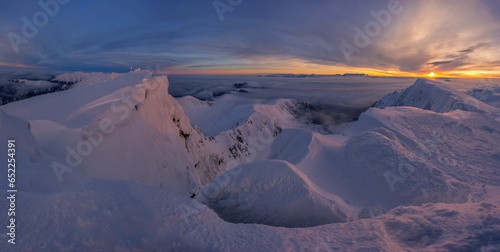 Beautiful, dramatic sunrise in the snowy mountains. Winter Slovakia mountain - Low Tatras from Dumbier, Chopok. Winter landscape.
