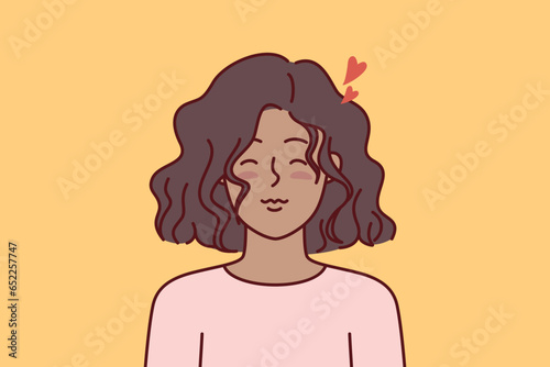 Little teen girl has romantic feelings and closes eyes, dreaming of loving boyfriend or big family. African american ethnic teenager girl with hearts near head symbolizing love and romance