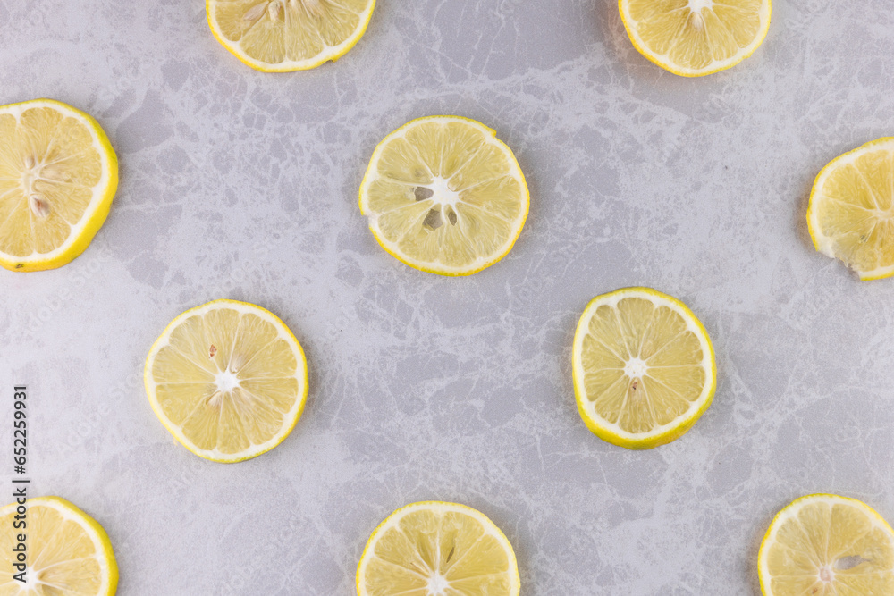 Diagonally Arranged Fresh Lemon Slices for a Background. flat lay photo.