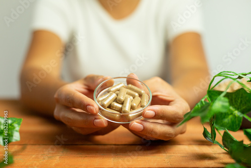 Obraz na płótnie Scientific analysis of dietary supplements, drug capsules undergoing research, ashwagandha in tablet form w salonie