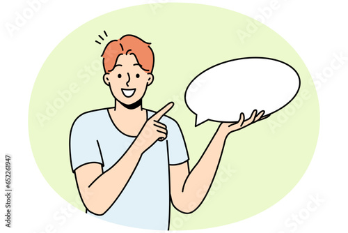 Smiling young man holding speech bubble in hands. Happy guy point at mockup empty blank copy space for advertising. Vector illustration.