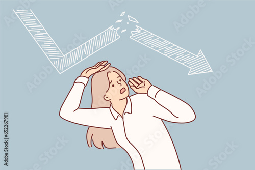 Frightened business woman sees crisis chart above head, symbolizing bankruptcy and economic problems