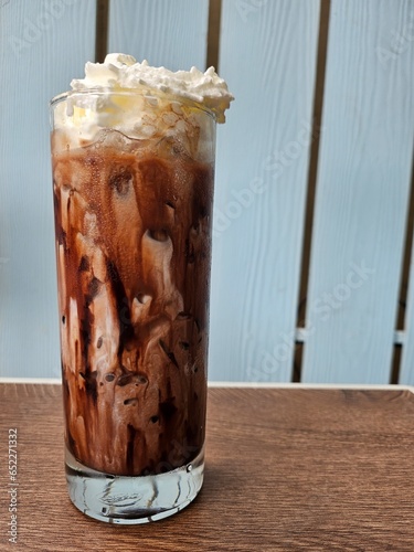 Ice Coffee with Milk foam and chocolate. Photo for coffee shop or cafe