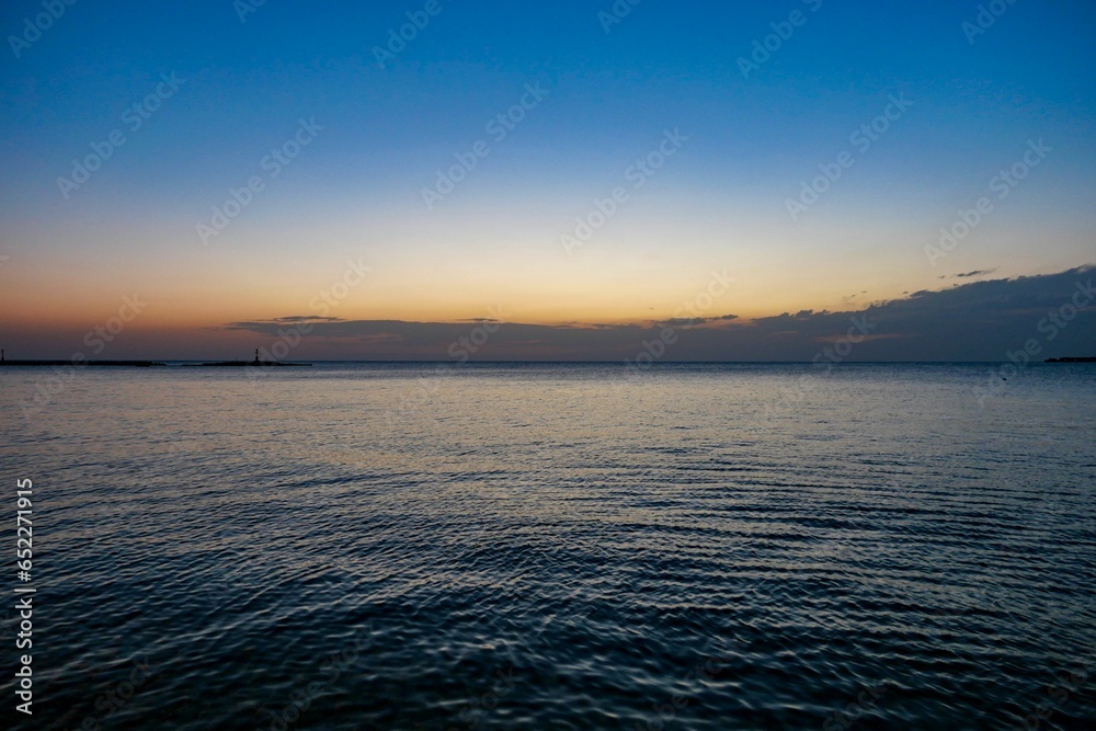 Obraz premium Scenic view of sunset on ocean waves in Porec, Istria, Croatia