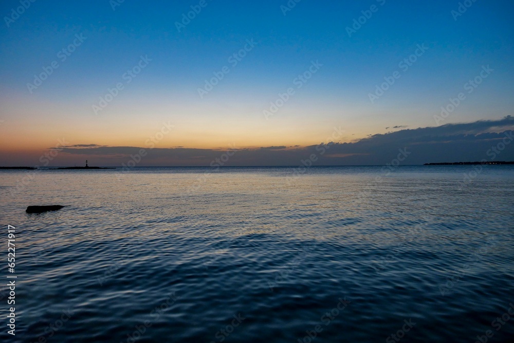 Scenic view of sunset on ocean waves in Porec, Istria, Croatia