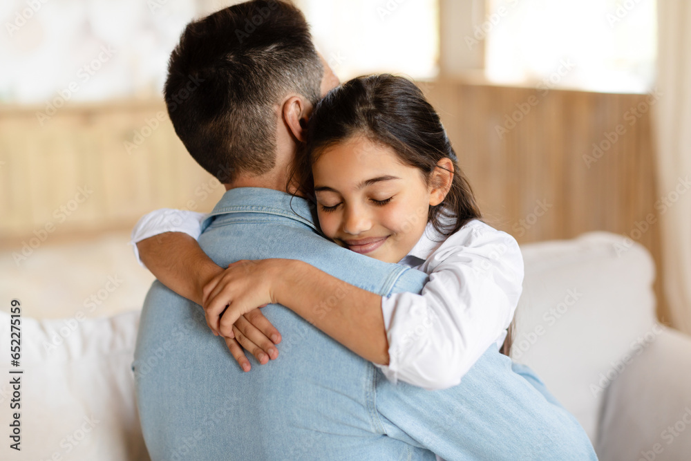 Portrait of daddy and daughter at home, girl hugging dad Portrait of daddy and daughter at home, girl hugging dad