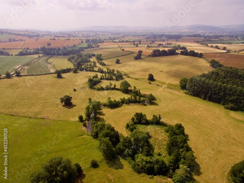 Aerial view of river Clun in green agricultural fields on a sunny morning photo