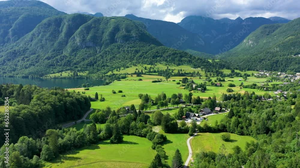 Aerial view of Bohinj lake in Julian Alps. Popular touristic destination in Slovenia. Bohinj Lake, Church of St John the Baptist. Triglav National Park, Julian Alps, Slovenia. Aerial view of Bohinj lake in Julian Alps. Popular touristic destination in Slovenia. Bohinj Lake, Church of St John the Baptist. Triglav National Park, Julian Alps, Slovenia.