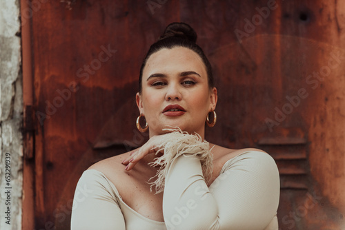 A close-up, unretouched portrait of a naturally beautiful young woman showcasing her authentic and unaltered facial features, capturing the essence of real beauty without any digital enhancements. photo