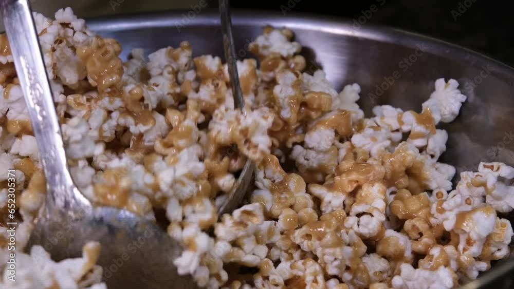 delicious sweet popcorn with lots of caramel, caramel flavor of popcorn close-up. High quality 4k footage delicious sweet popcorn with lots of caramel, caramel flavor of popcorn close-up. High quality 4k footage