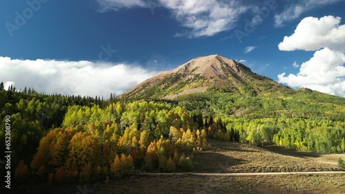 Aerial of Gothic Mountain in Crested Butte Colorado in fall with yellow aspens and blue sky photo