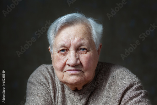 Elderly, smile woman in the studio