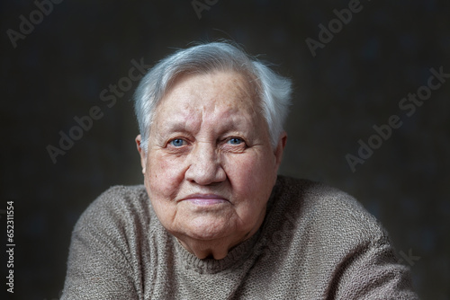 Elderly, smile woman in the studio