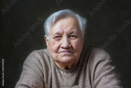 Elderly, smile woman in the studio
