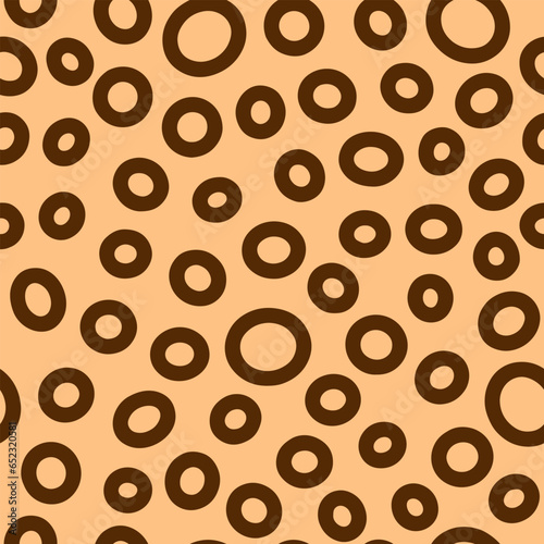Seamless neutral rings pattern. Brown hand-drawn oval on beige background. Doodle dots cozy ornament. Vector boho illustrations with circles for wallpaper, posters, wrapping paper, textile, fabric