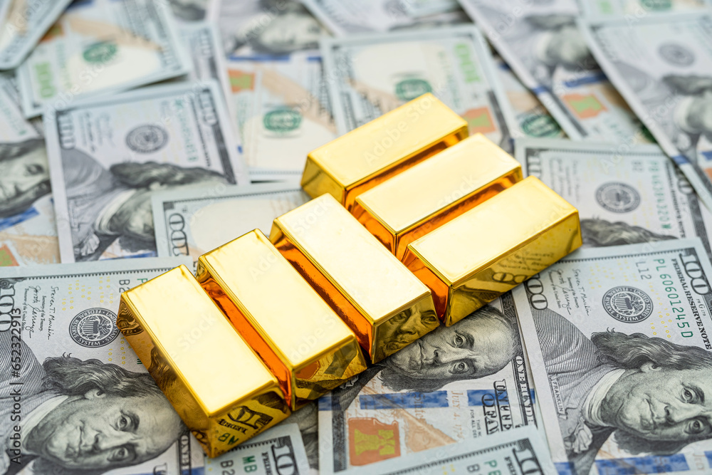 gold bars reflection on dollar bills background. The concept of finance wealth and rich gold bars reflection on dollar bills background. The concept of finance wealth and rich