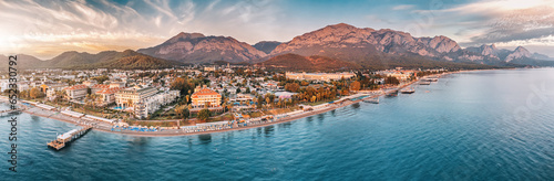 beauty of Kemer from a new perspective with breathtaking aerial view, showcasing a stunning panorama of hotels nestled amidst the scenic mountain landscape. photo