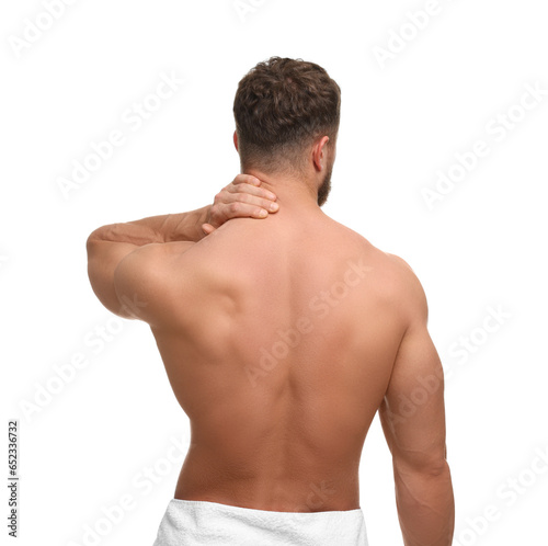 Man suffering from neck pain on white background, back view