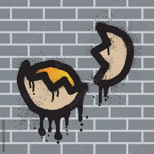 Broken egg graffiti with black spray paint on brick wall background