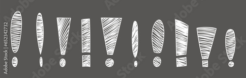 Hand drawn exclamation marks set. Hand drawn chalk doodles exclamation marks on black chalkboard. Scribble exclamation point sign. Sketch of punctuation sign