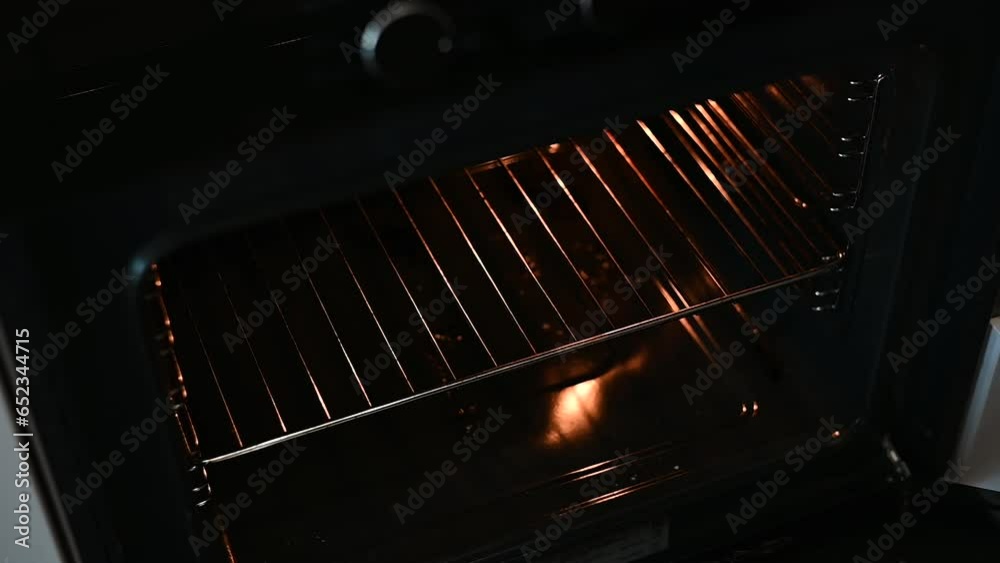 Putting the cake in the oven for baking Putting the cake in the oven for baking