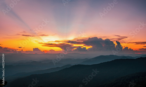 beautiful sunset with clouds in the mountains that are intricate
