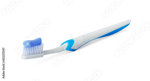 Plastic toothbrush with paste on white background