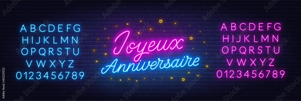 Joyeux Anniversaire neon lettering on brick wall background. Happy Birthday in French - obrazy, fototapety, plakaty 
