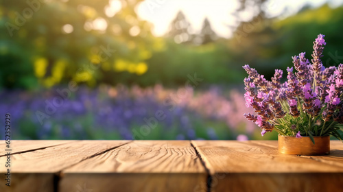 Lavender bouquet on the wooden table at organic lavender farm background. © Sunday Cat Studio