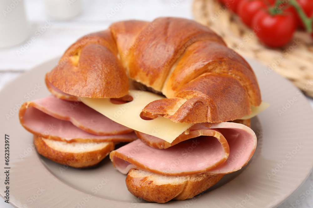 Tasty crescent roll with ham and cheese on table, closeup Tasty crescent roll with ham and cheese on table, closeup