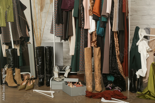 Konstfotografi Untidy cluttered woman wardrobe with stylish clothes and accessories