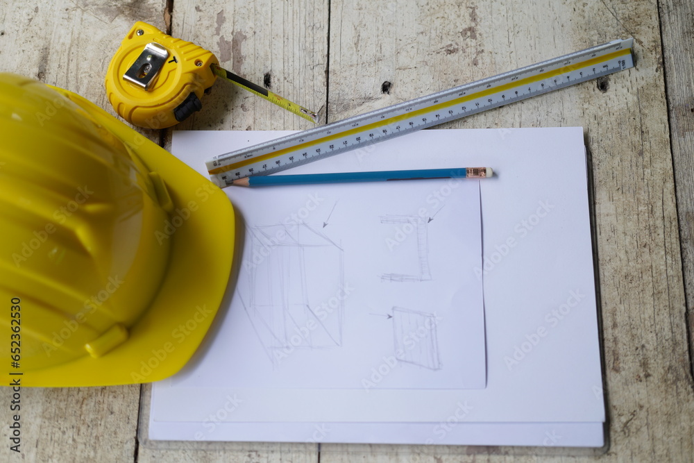 Set of professional construction tools and safety helmet on a work ...