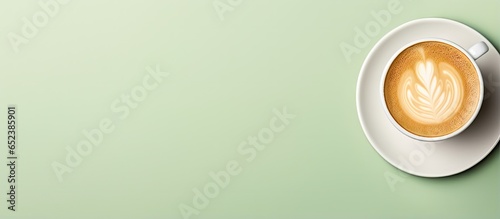 Green cappuccino with hot cream isolated pastel background Copy space