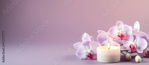 Orchid flowers adorn a lit ...