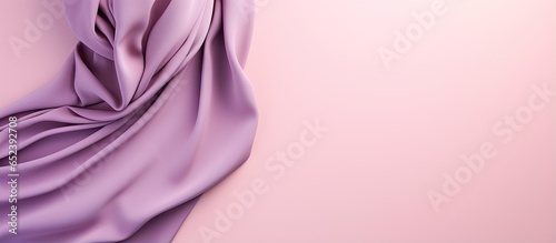 Colorful hijab folded on a isolated pastel background Copy space a trendy accessory for women photo
