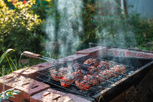 golden brown grilled chicken meat is cooked on the grill outdoors