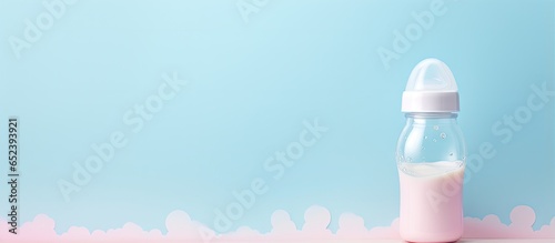 Infant formula on a isolated pastel background Copy space with a feeding bottle © vxnaghiyev