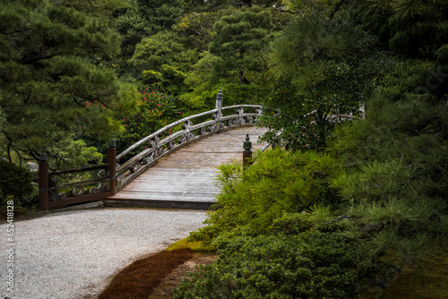 The entrance to a beautiful bridge spanning a pond on the castle grounds in Kyoto, Japan.
