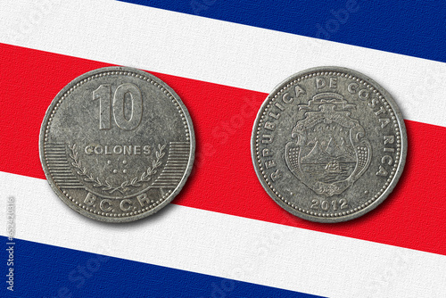 Costa rican colon coin on a national flag photo