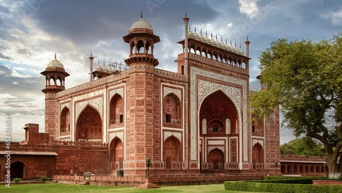 Taj Mahal east gate - A beautifully crafted red sandstone structure bearing the heritage of Mughal architecture in India. photo