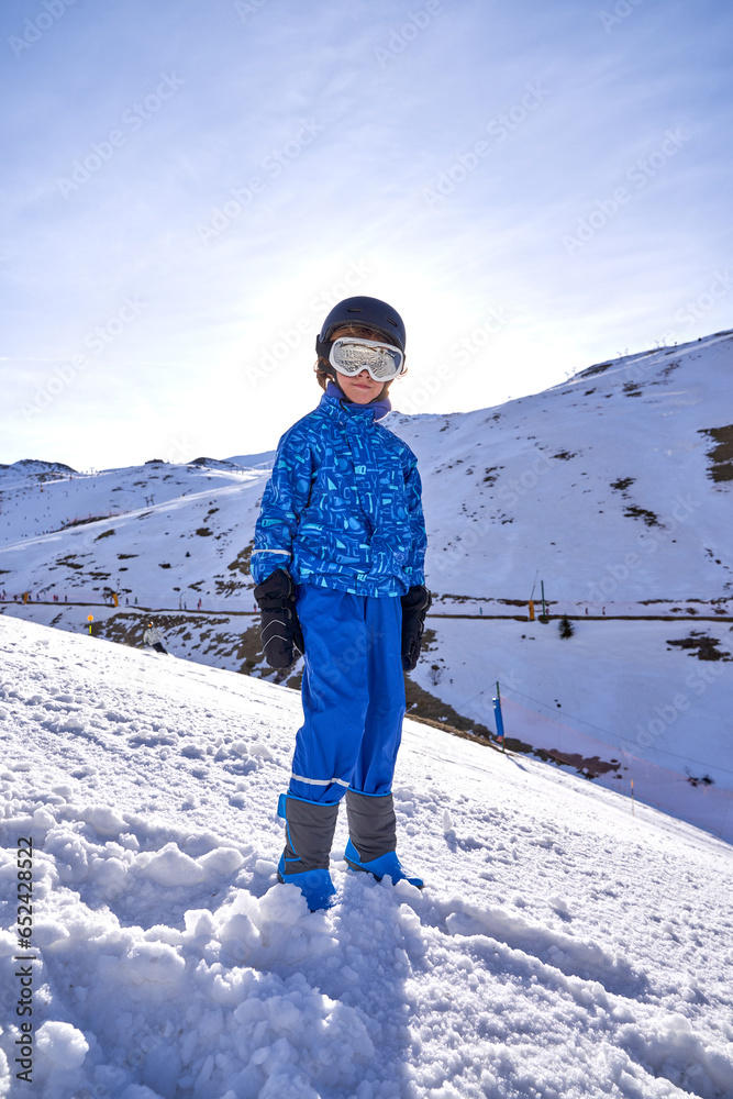 Boy spending time in snowy mountains
